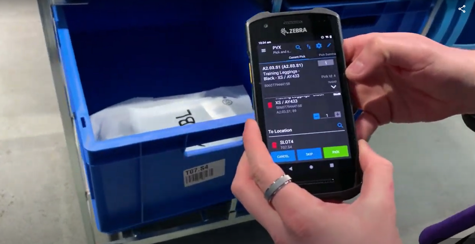 Warehouse worker uses mobile WMS to find correct item