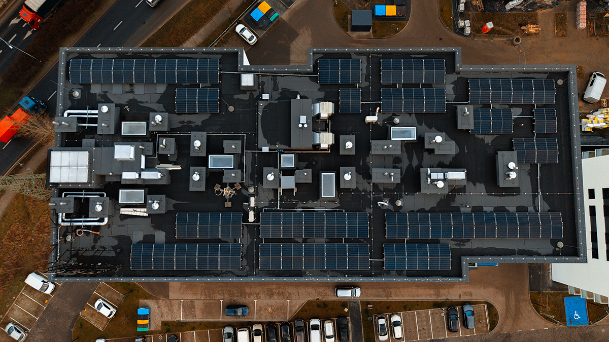 Warehouse roof with clean energy solar panels and HVAC