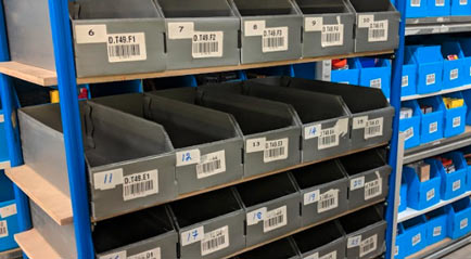 Warehouse barcoding with labels on individual bins